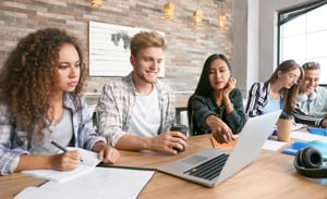 hero_-_group_of_students_working_collaboratively_pointing_at_a_laptop_screen