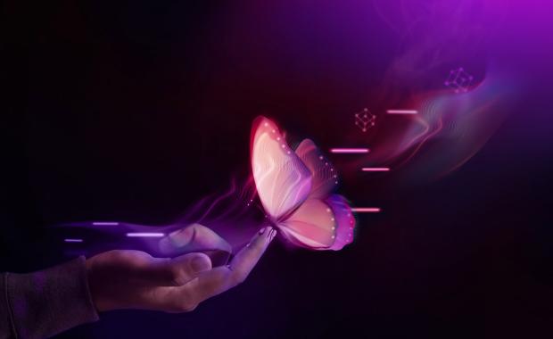 hero_-_hand_reaching_out_to_touch_a_purple_butterfly_graphic